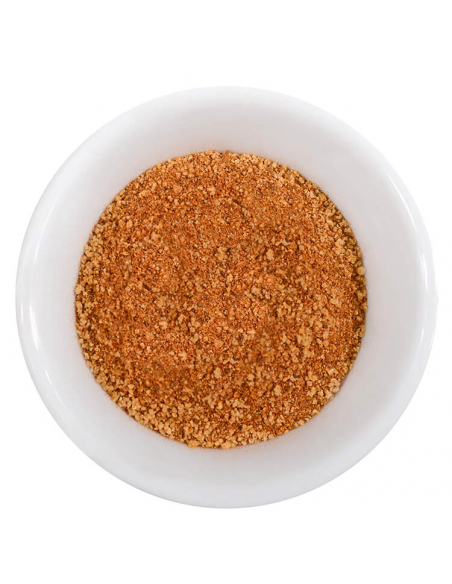 Schale mit fein gemahlenem, rötlich-braunem Geflügelgewürz. Schale mit fein gemahlenem, rötlich-braunem Geflügelgewürz.