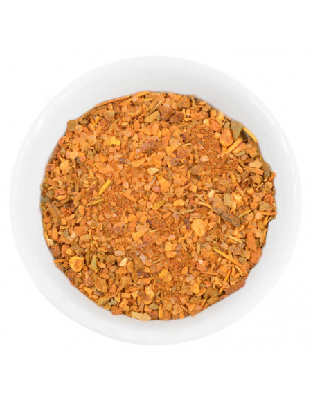 Eine weiße Schale gefüllt mit einer grobkörnigen, orange-braunen Gewürz- und Kräutermischung. Eine weiße Schale gefüllt mit einer grobkörnigen, orange-braunen Gewürz- und Kräutermischung.