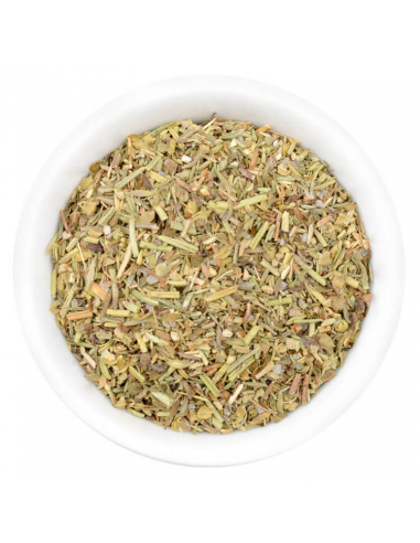 Eine weiße Schale gefüllt mit einer fein geschnittenen, hellgrünen bis beigen Kräutermischung mit roten Sprenkeln.