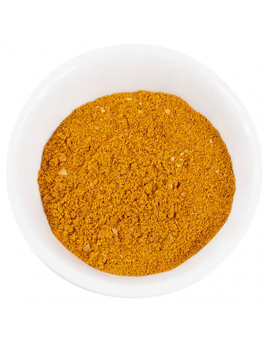 Weiße Schale mit gelb-orangem Currypulver