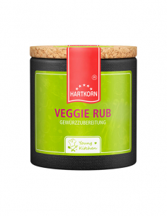 Pappdose mit Korkdeckel und grünem Etikett, beschriftet mit „Veggie Rub“.