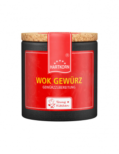 Pappdose mit Korkdeckel und rotem Etikett, beschriftet mit „Wok Gewürz“.