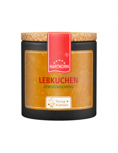 Pappdose mit Korkdeckel und orangefarbenem Etikett, beschriftet mit „Lebkuchen"