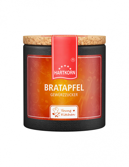Pappdose mit Korkdeckel und orangefarbenem Etikett, beschriftet mit „Bratapfel“.