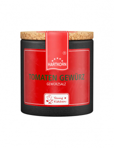 Pappdose mit Korkdeckel und rotem Etikett, beschriftet mit „Tomaten Gewürz“.