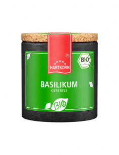 Runde schwarzes Pappdose mit grünem Etikett und Korkdeckel, Aufschrift „Basilikum gerebelt“.