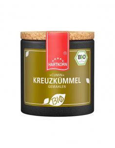 Dunkle Pappdose mit olivbraunem Etikett, Aufschrift ‚»CUMIN« KREUZKÜMMEL GEMAHLEN‘ und Bio-Siegel