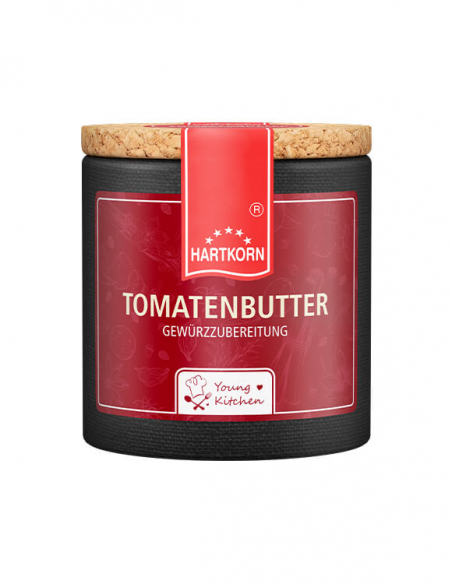 Pappdose mit Korkdeckel und rotem Etikett, beschriftet mit „Tomatenbutter“.