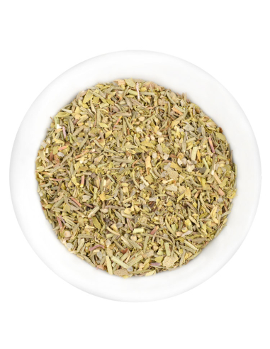 Eine weiße Schale gefüllt mit einer fein geschnittenen, hellgrünen bis beigen Kräutermischung mit roten Sprenkeln.