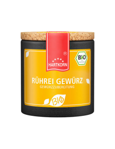 Pappdose mit rotem Etikettband und gelbem Etikett mit der Aufschrift „RÜHREI GEWÜRZ GEWÜRZZUBEREITUNG“