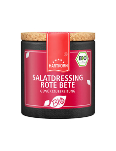 Pappdose mit rotem Etikettband und pinkem Etikett mit der Aufschrift „SALATDRESSING ROTE BETE GEWÜRZZUBEREITUNG“.