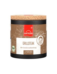Schwarze Pappdose mit Korkdeckel, Etikett in Braun mit rotem Band: 'Hartkorn Grillsteak Gewürzmischung', BIO-Siegel sichtbar.