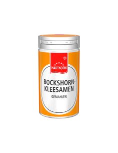 Dose mit orangefarbenem Etikett, Aufschrift: „Hartkorn Bockshornkleesamen gemahlen“