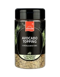 Schwarze Gewürzdose mit grünem Etikett und der Aufschrift „Avocado Topping“.