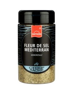Schwarze Gewürzdose mit blauem Etikett und der Aufschrift „Fleur de Sel Mediterran“.