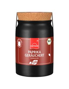 Schwarze Keramiktöpfchen mit der Aufschrift „PAPRIKA GERÄUCHERT gemahlen“.