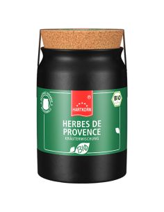 Schwarzes Keramiktöpfchen mit dunkelgrünem Etikett und Korkdeckel, Aufschrift „Herbes de Provence“.