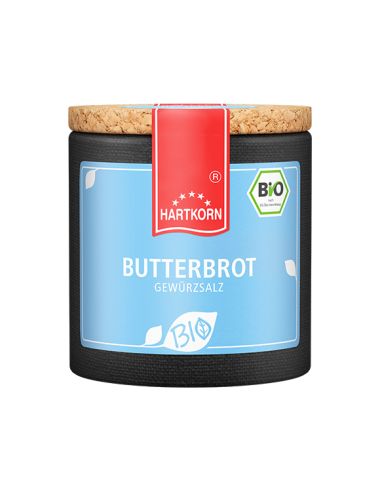 Hellblaue Keramikdose mit rotem Etikett und Korkdeckel, beschriftet mit „Butterbrot – Bio“.