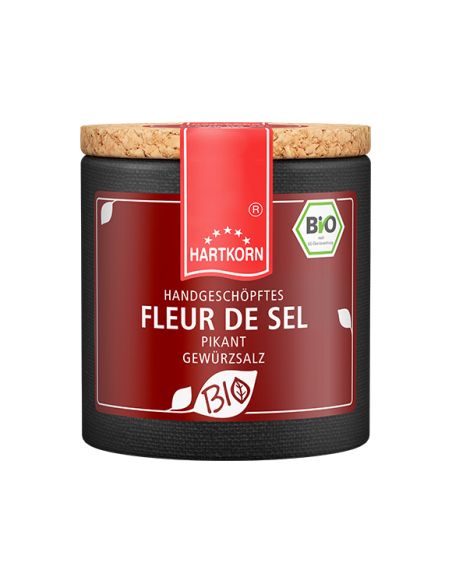 Dunkelrote Pappdose mit rotem Etikett und Korkdeckel, beschriftet mit „Fleur de Sel – Bio“. Dunkelrote Pappdose mit rotem Etikett und Korkdeckel, beschriftet mit „Fleur de Sel – Bio“.