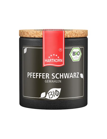 Schwarze Pappdose mit Korkdeckel und rotem Etikett, Aufschrift „Pfeffer schwarz“. Schwarze Pappdose mit Korkdeckel und rotem Etikett, Aufschrift „Pfeffer schwarz“.