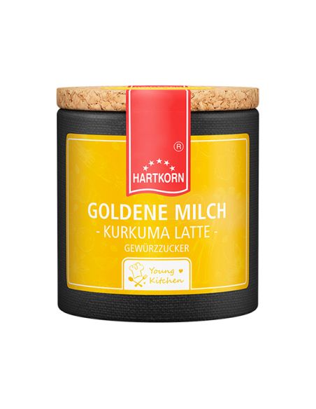 Gelbe Pappdose mit rotem Etikett und Korkdeckel. Aufschrift: „GOLDENE MILCH – Kurkuma Latte“. Gelbe Pappdose mit rotem Etikett und Korkdeckel. Aufschrift: „GOLDENE MILCH – Kurkuma Latte“.