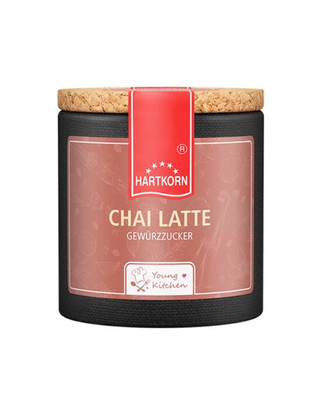 Rosa-beige Pappdose mit Korkdeckel und rotem Etikett, Aufschrift „Chai Latte“. Rosa-beige Pappdose mit Korkdeckel und rotem Etikett, Aufschrift „Chai Latte“.