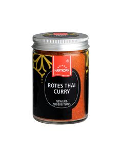 Glas mit Hartkorn-Logo, rotem Thai-Currypulver und silbernem Schraubdeckel