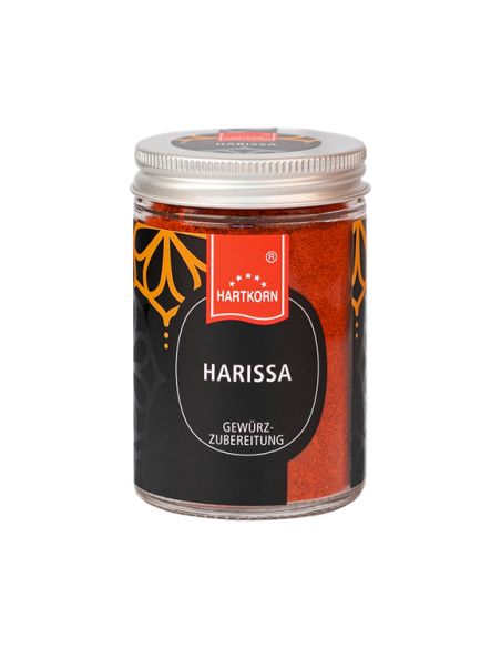 Glas mit Hartkorn-Logo, befüllt mit rotem Harissa-Gewürzpulver und silbernem Schraubdeckel