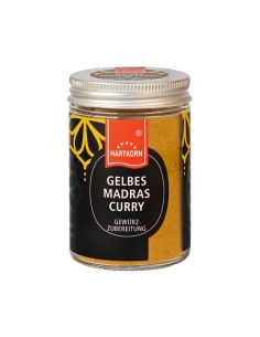 Glas mit Hartkorn-Logo, gelbem Madras Currypulver und silbernem Schraubdeckel