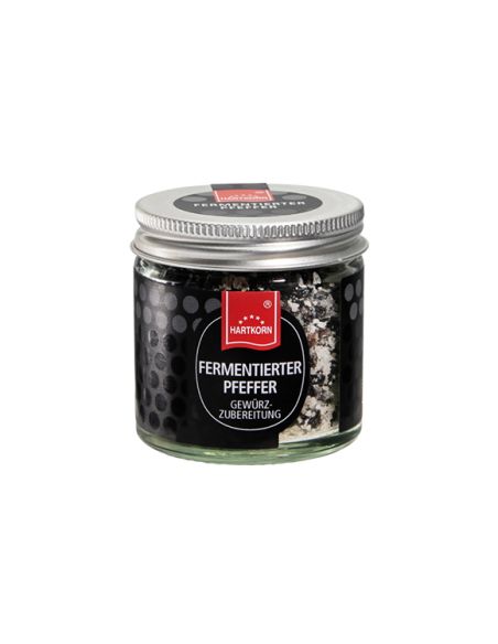 Glas mit fermentiertem Pfeffer von Hartkorn, mit schwarzem Etikett und silbernem Schraubdeckel.
