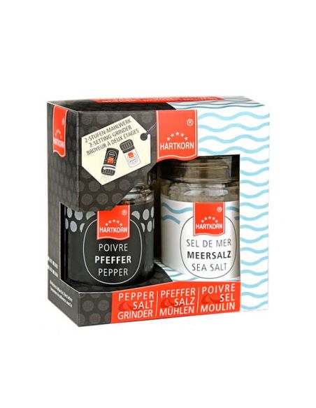 Geschenkset mit zwei Hartkorn-Gewürzmühlen in offener Verpackung: links schwarzer Pfeffer, rechts grobes Meersalz.