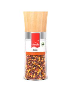 Durchsichtige Gewürzmühle mit Holzdeckel. Etikett mit rotem Hartkorn-Logo und der Aufschrift „Chili-Flocken“.