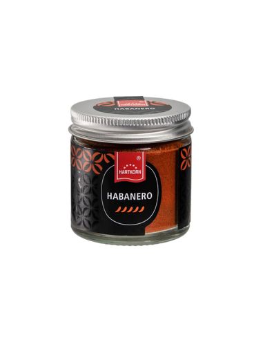 Kleines Schraubglas mit schwarzem Etikett und feinem orangenem Pulver.