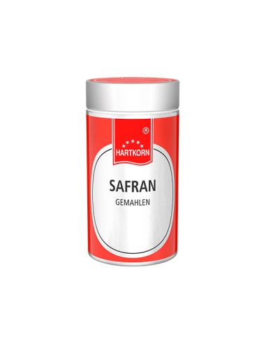 Silberner Gewürzstreuer mit rotem Deckel, Etikett mit Aufschrift „Safran gemahlen“.