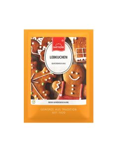 Flachbeutel mit der Aufschrift „Lebkuchen“, dahinter Kekse in Lebkuchenform mit Zuckerguss.