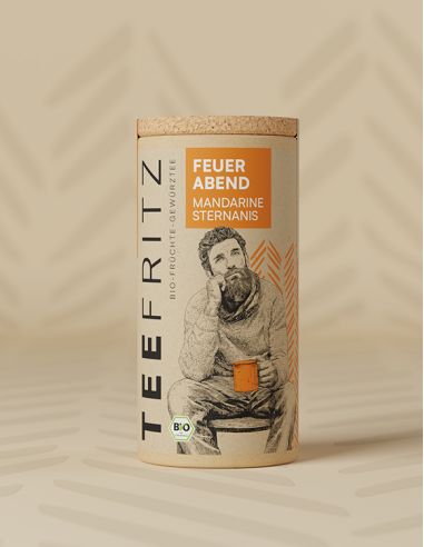 Teefritz Dose „Feuer Abend“ Mandarine Sternanis, mit Illustration eines Mannes mit Schal und orangefarbenem Etikett.