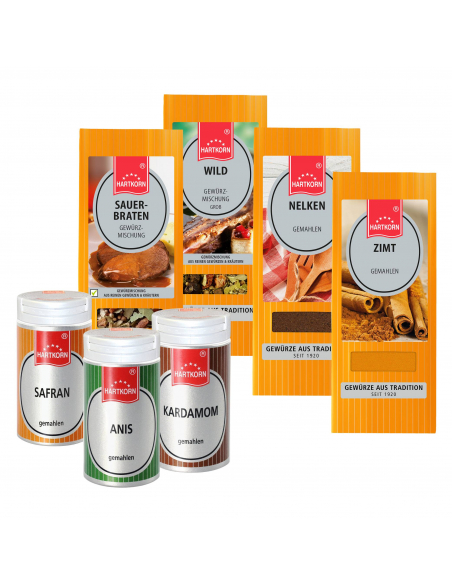 Mehrere Gewürzverpackungen in Orange und Weiß mit durchsichtigem Fenster und silbernem Etikett. Mehrere Gewürzverpackungen in Orange und Weiß mit durchsichtigem Fenster und silbernem Etikett.