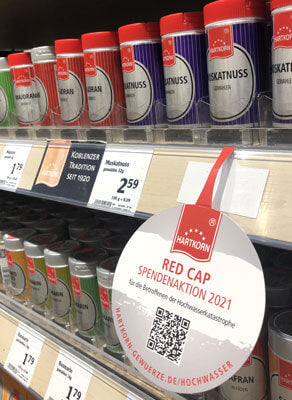 Hartkorn Red Cap-Spendendosen im Supermarkt Regal. 