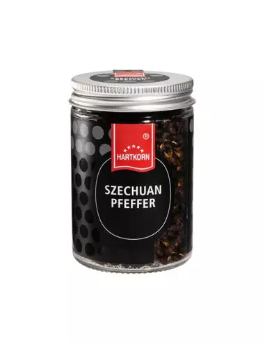 Glas mit dunklem Szechuan Pfeffer und silbernem Schraubdeckel